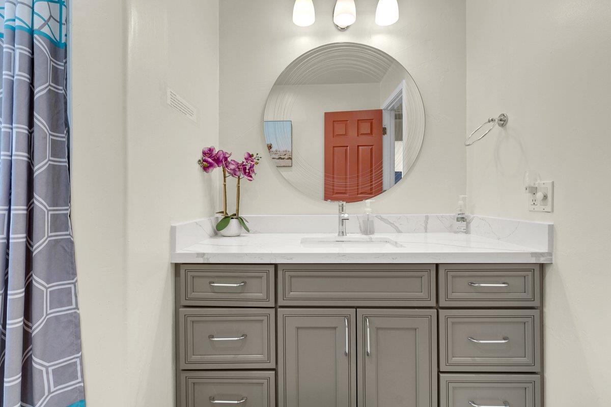 965 Portola Drive Del Rey Oaks, CA 93940 - Photo 17 of 23 a bathroom with a sink and a mirror