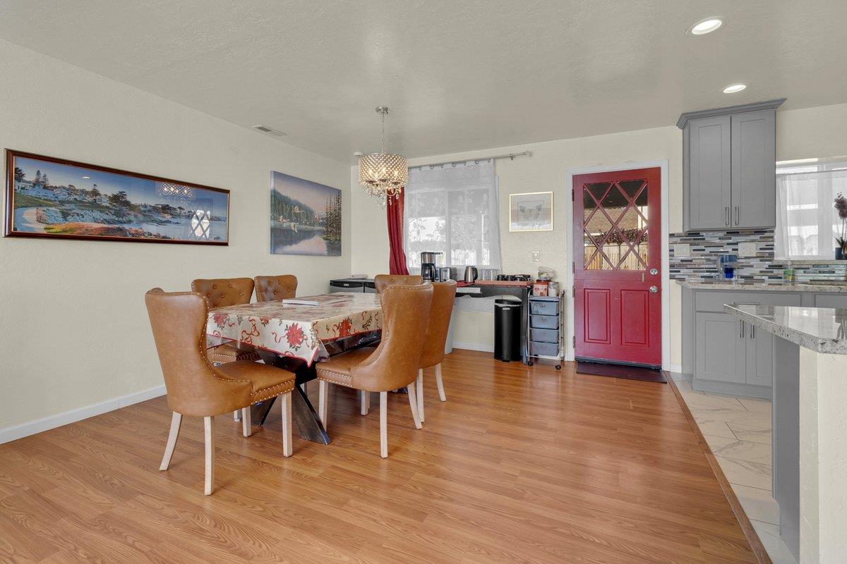 965 Portola Drive Del Rey Oaks, CA 93940 - Photo 8 of 23 a view of a dining room with furniture and wooden floor