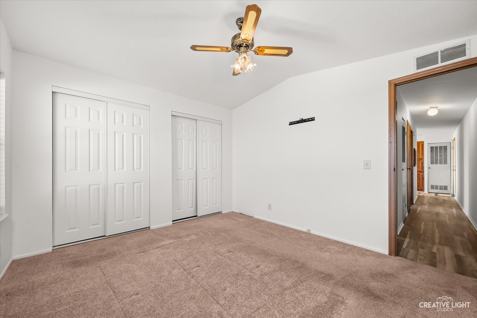 120 B Cardinal Lane Sandwich, IL 60548 - Photo 13 of 15 a view of a hallway with a chandelier fan