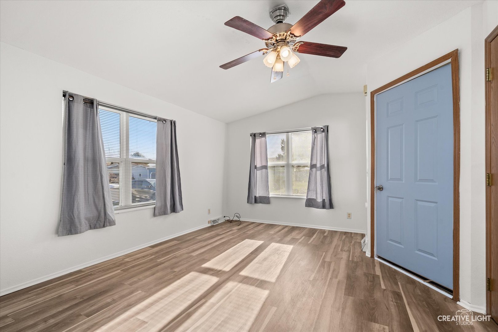 120 B Cardinal Lane Sandwich, IL 60548 - Photo 2 of 15 wooden floor in an empty room with a window