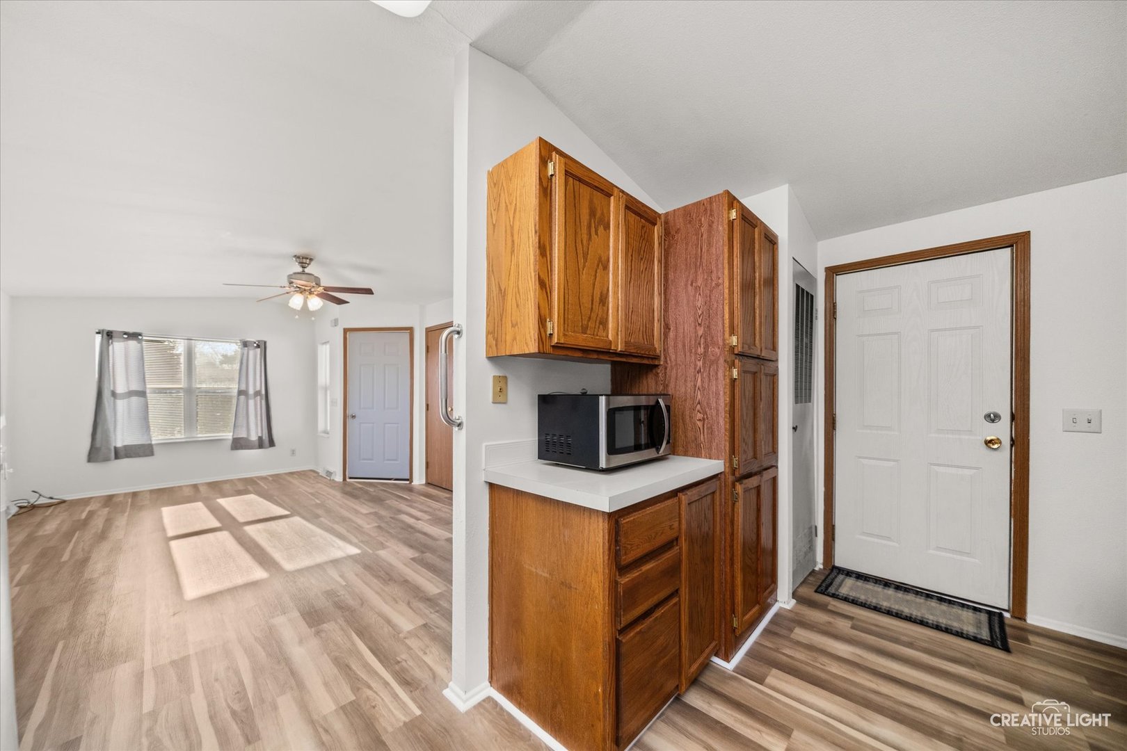 120 B Cardinal Lane Sandwich, IL 60548 - Photo 7 of 15 a view of kitchen with cabinets and wooden floor