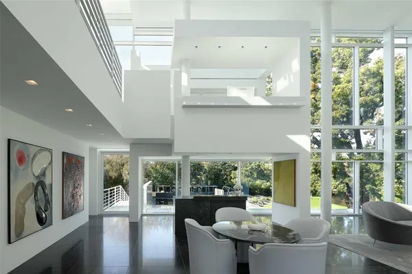 a kitchen with stainless steel appliances kitchen island granite countertop a sink and cabinets