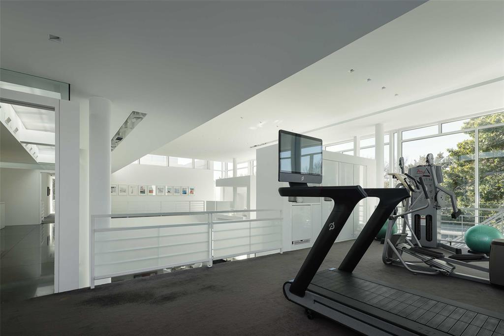 8605 Preston Road Dallas, TX 75225 - Photo 23 of 40 a view of a room with gym equipment