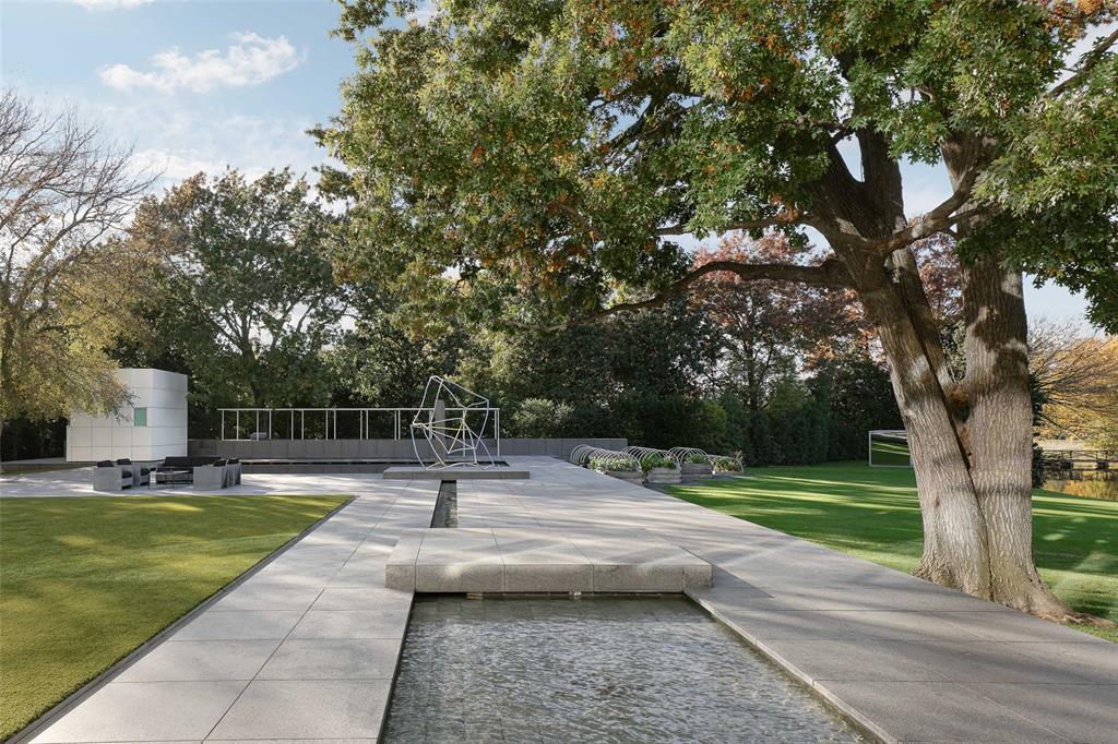8605 Preston Road Dallas, TX 75225 - Photo 28 of 40 a swimming pool with outdoor seating and yard