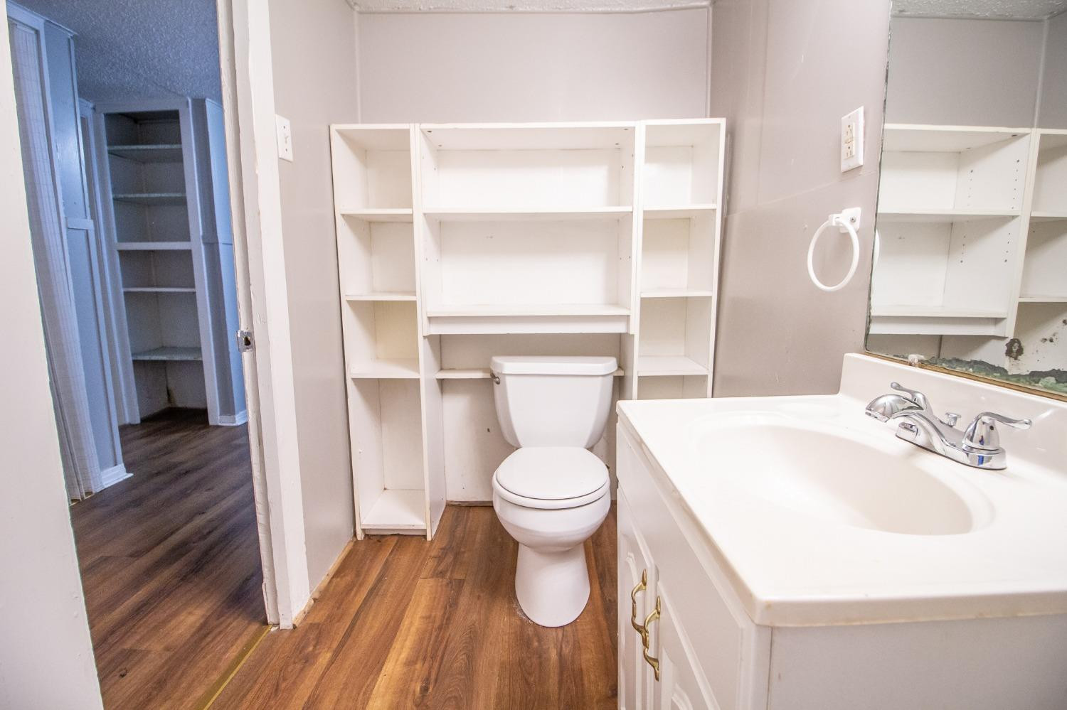 2429 27th Street Lubbock, TX 79411 - Photo 13 of 16 a bathroom with a sink toilet and vanity