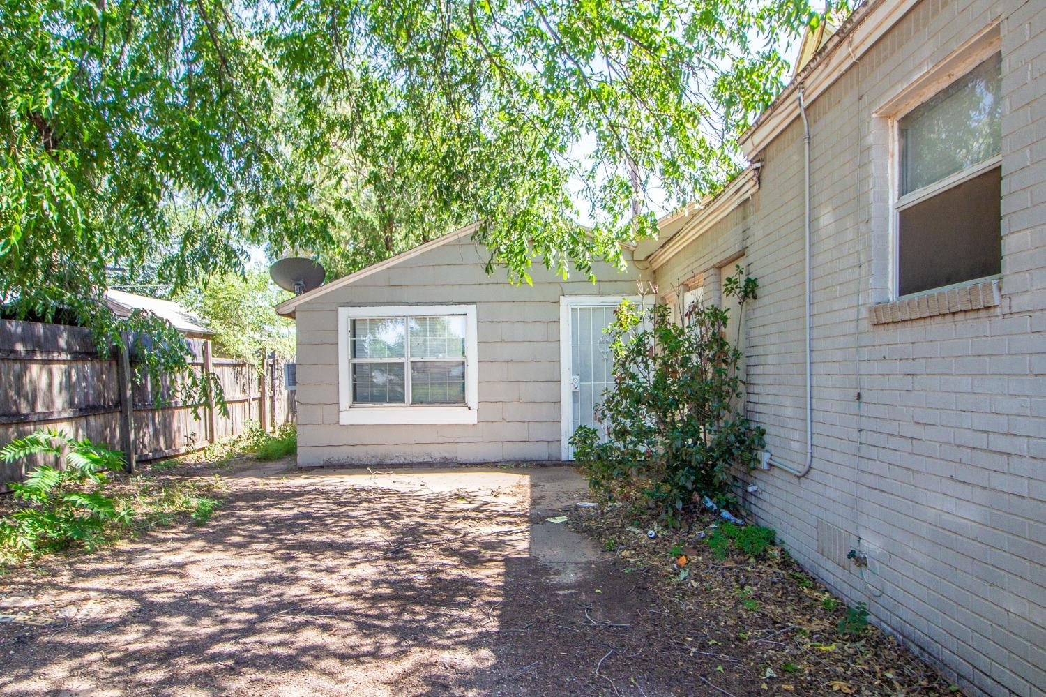 2429 27th Street Lubbock, TX 79411 - Photo 14 of 16 a front view of a house with garden