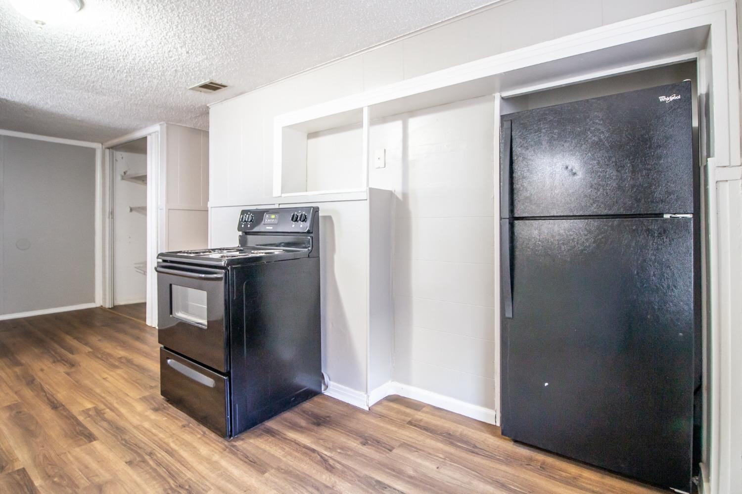 2429 27th Street Lubbock, TX 79411 - Photo 7 of 16 a kitchen with stainless steel appliances granite countertop a refrigerator and a stove