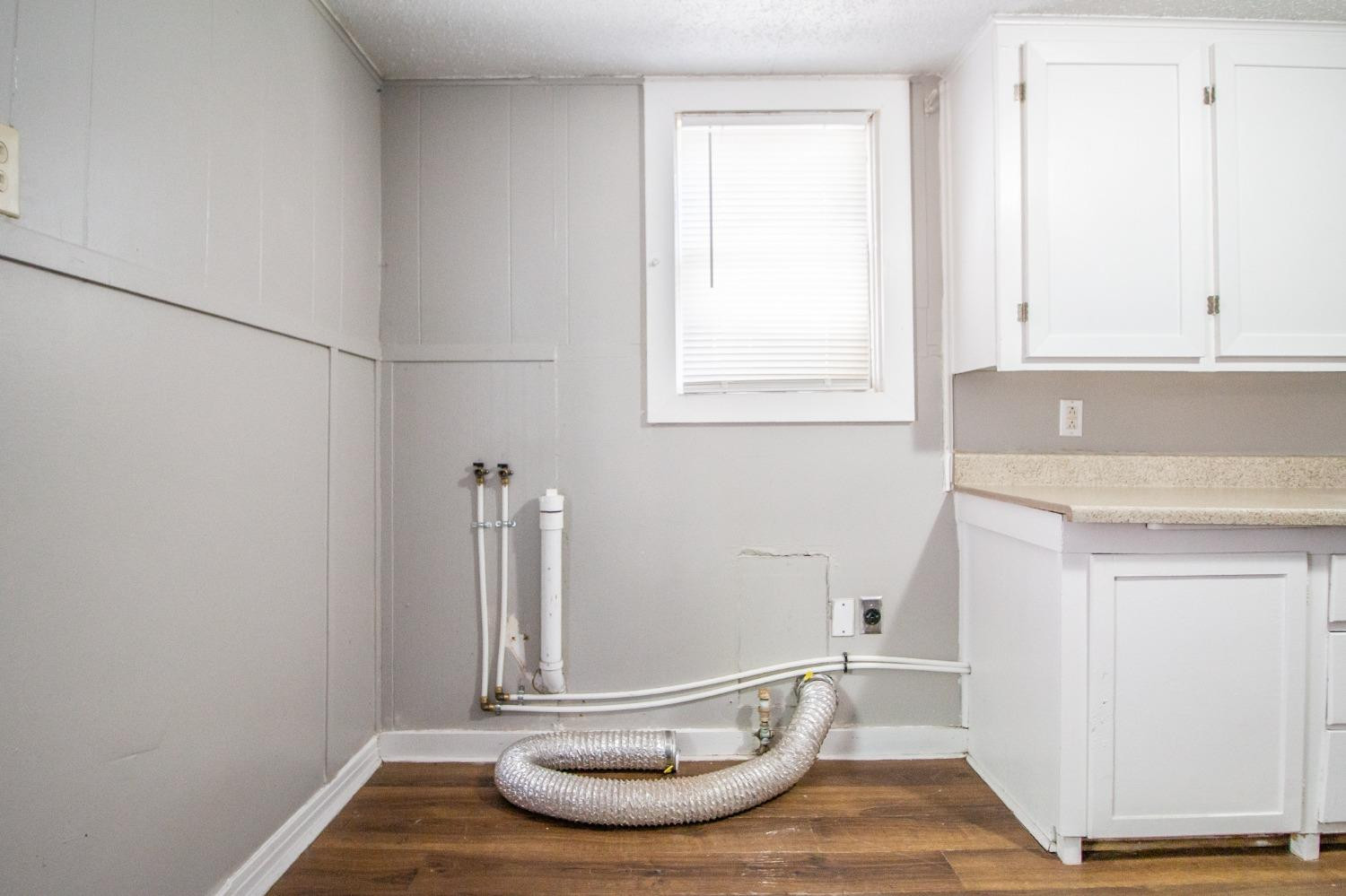 2429 27th Street Lubbock, TX 79411 - Photo 10 of 16 a room with a sink and a window