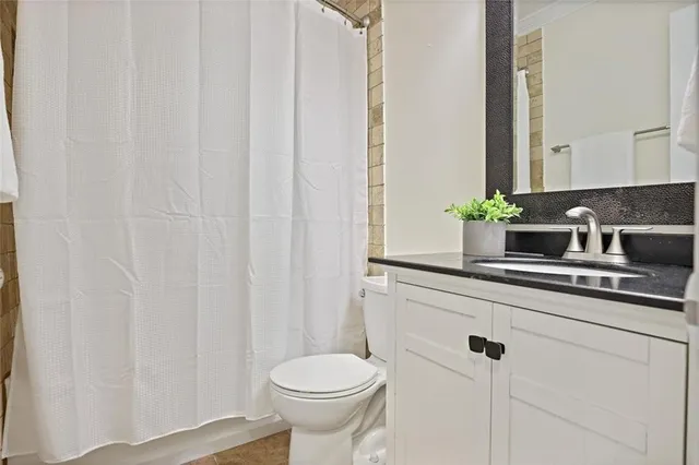 a bathroom with a sink and a toilet