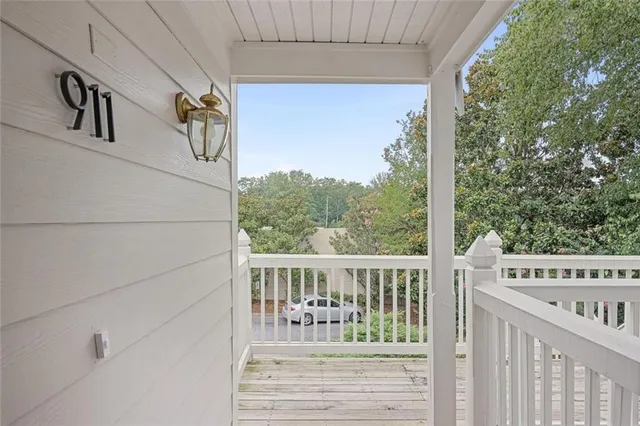 a view of a porch with wooden floor