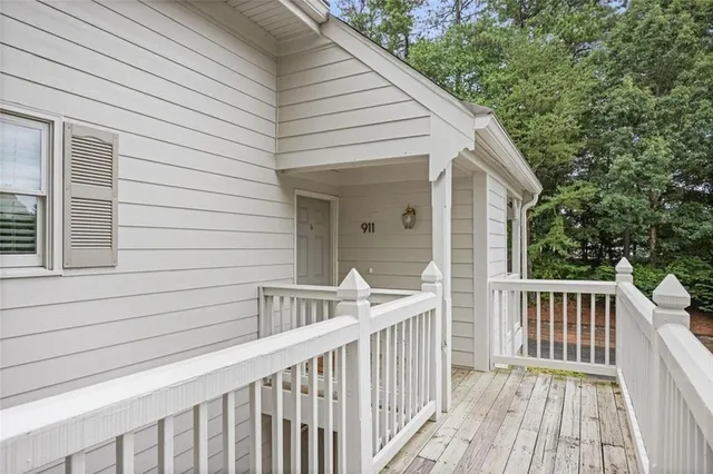 a view of a wooden house with a deck