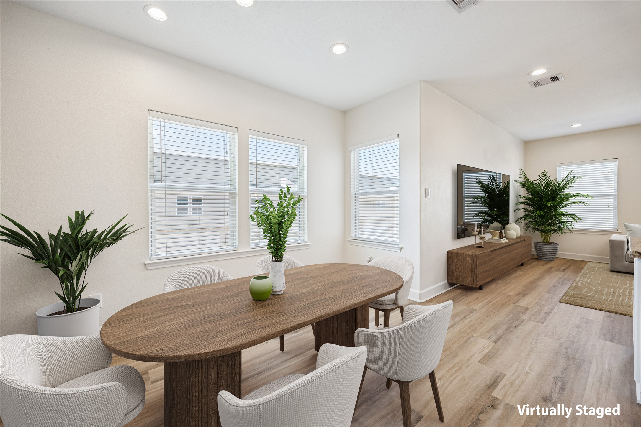 5402 Jonathan Lane Houston, TX 77011 - Photo 7 of 33 Elevate your dining experience in this stylish second-floor space, featuring abundant natural light and a seamless flow into the living area, perfect for entertaining.
