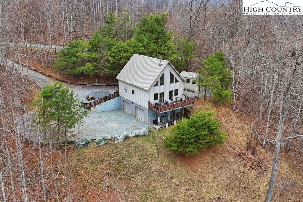408 Eagle Ridge Road Roan Mountain, TN 37687 - Photo 35 of 45 a view of a house with a yard and sitting area