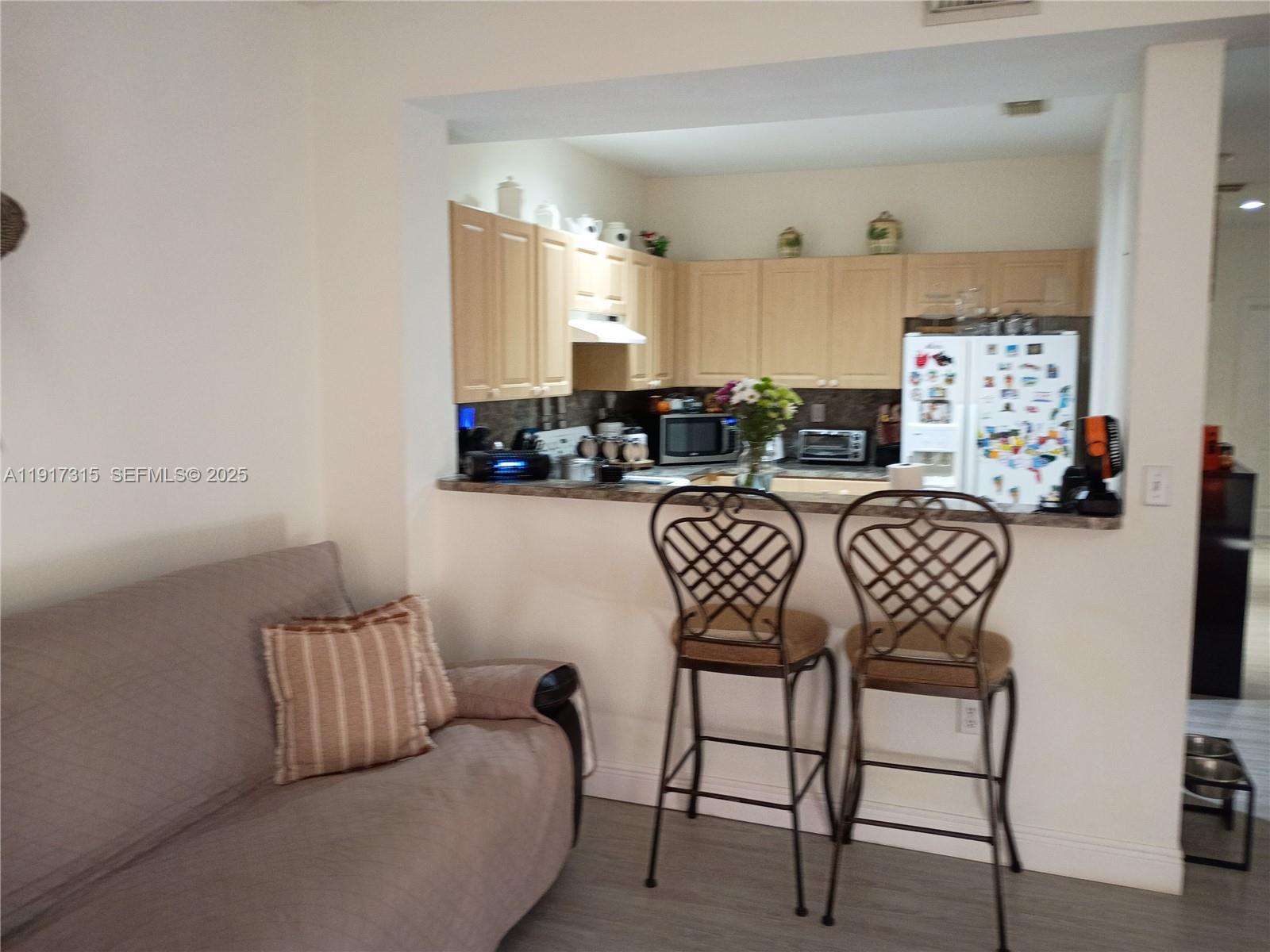 13274 Southwest 142nd Terrace, Unit 13274 Miami, FL 33186 - Photo 18 of 32 a view of a livingroom with furniture