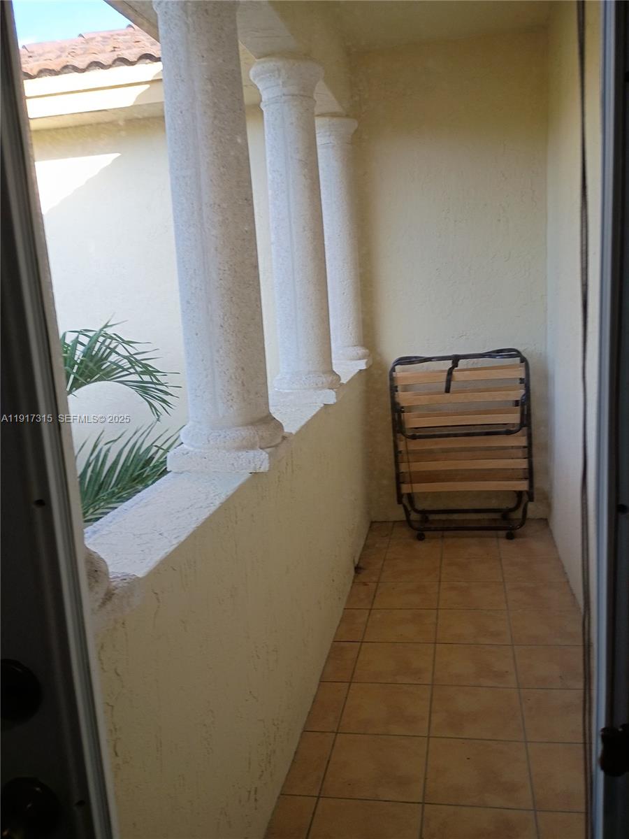 13274 Southwest 142nd Terrace, Unit 13274 Miami, FL 33186 - Photo 25 of 32 a view of a room with window and stairs