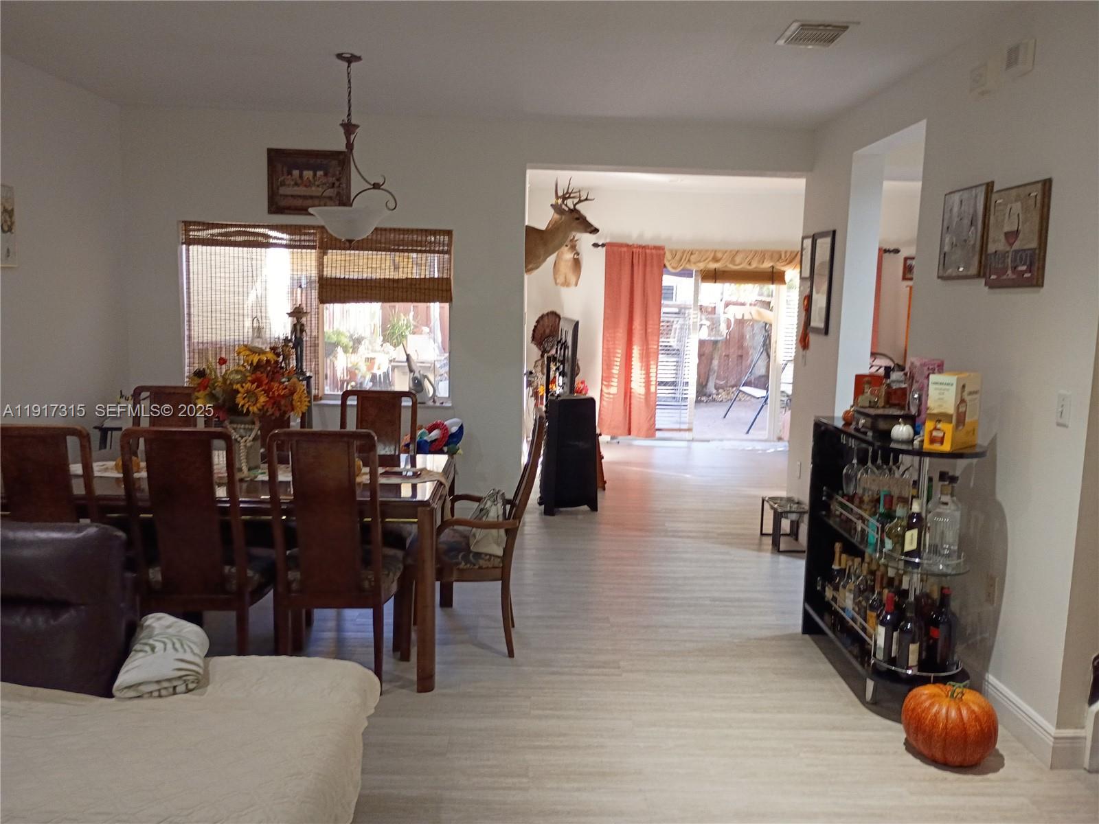 13274 Southwest 142nd Terrace, Unit 13274 Miami, FL 33186 - Photo 26 of 32 a dining room with furniture and window