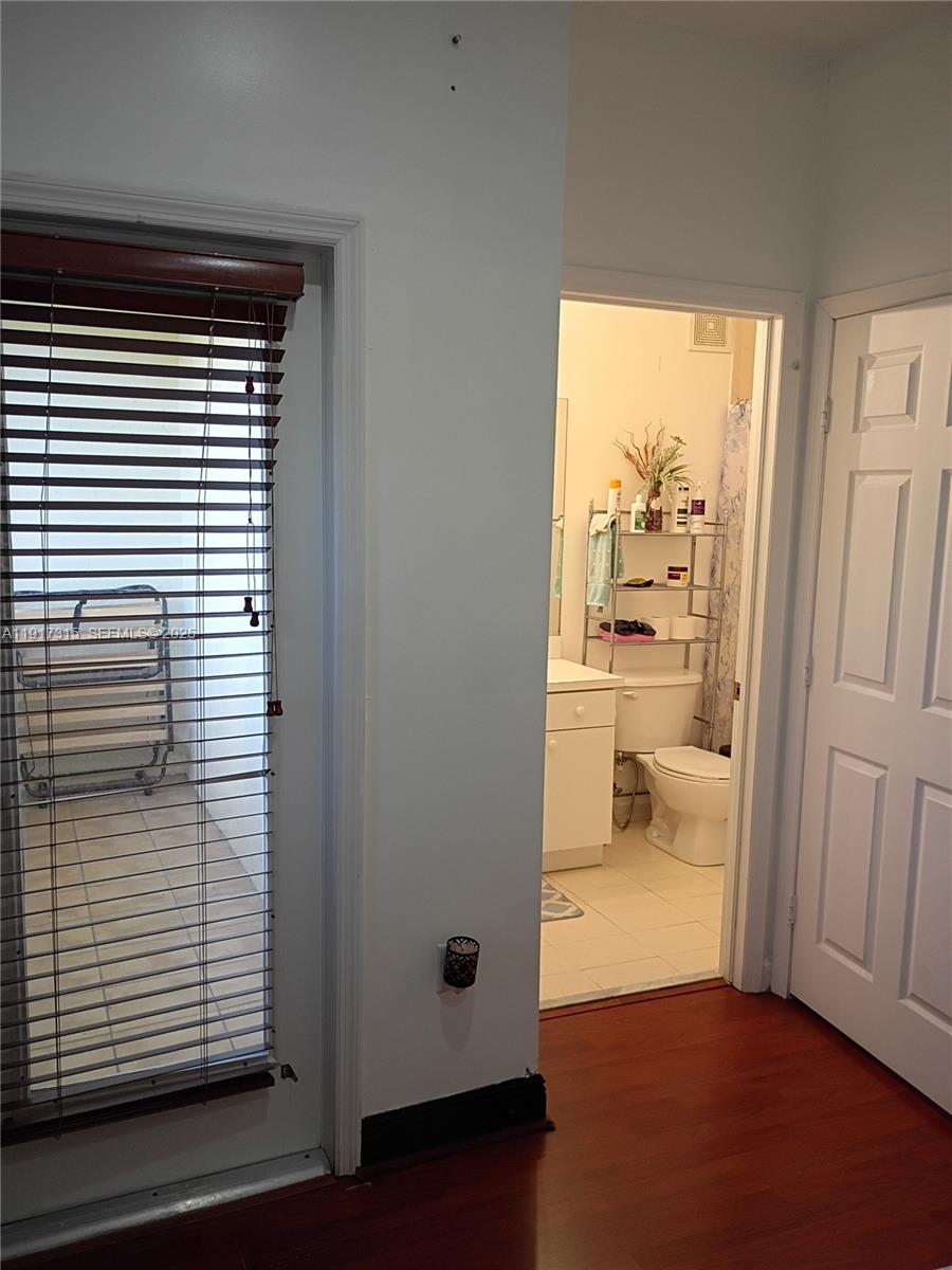 13274 Southwest 142nd Terrace, Unit 13274 Miami, FL 33186 - Photo 9 of 32 a view of a room that has a large window