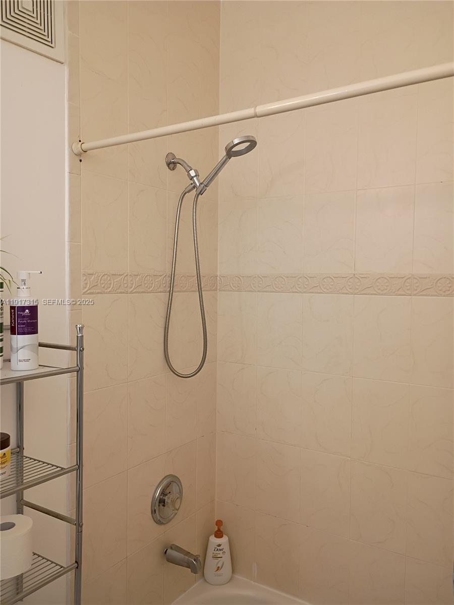 13274 Southwest 142nd Terrace, Unit 13274 Miami, FL 33186 - Photo 10 of 32 a bathroom with a shower