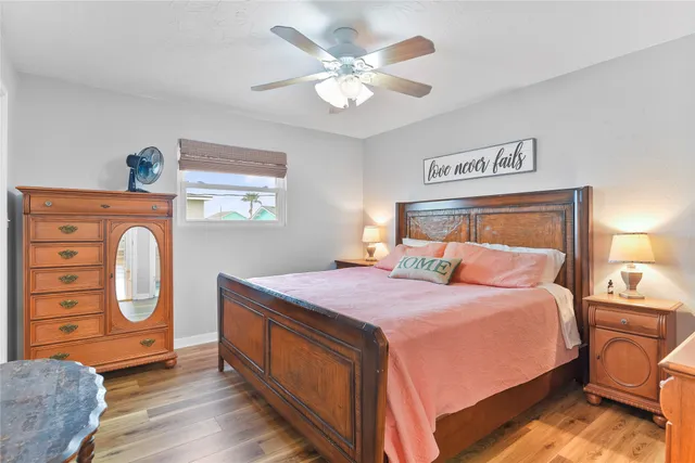 a bedroom with a bed and dresser