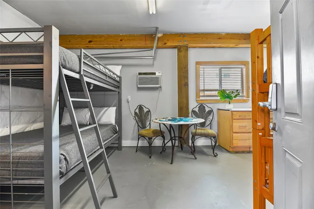 a dining room with a table and chairs