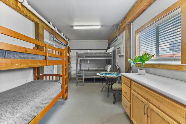 a reading room with furniture and a potted plant