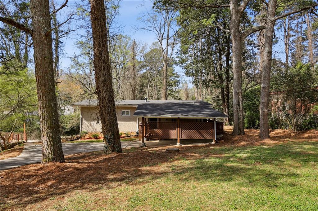 1291 Richard Road Decatur, GA 30032 - Photo 16 of 16 a view of a house with a yard