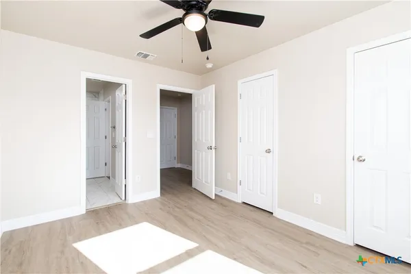 a bathroom with a bathtub sink mirror and toilet