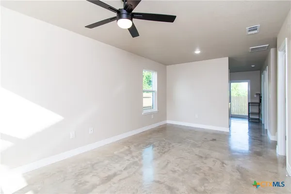a view of an empty room and window