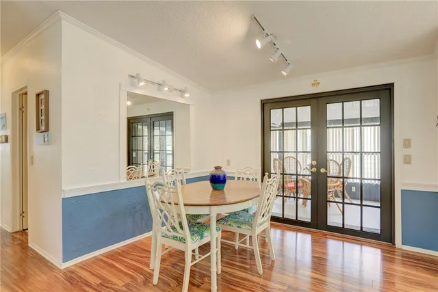 a bedroom with bed and a chandelier