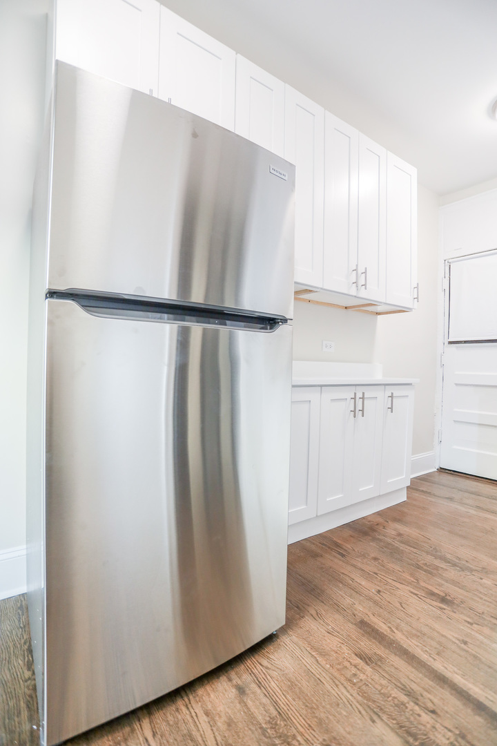 5742 South Stony Is Avenue, Unit 14 Chicago, IL 60637 - Photo 2 of 13 a view of cabinets with wooden floor