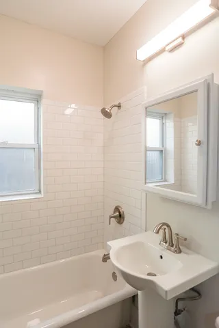 a kitchen with cabinets a sink and appliances