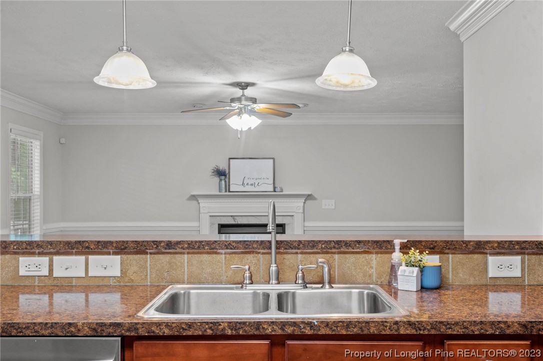 195 Culpepper Road Cameron, NC 28326 - Photo 14 of 46 a kitchen with a sink granite counter tops and a view of living room