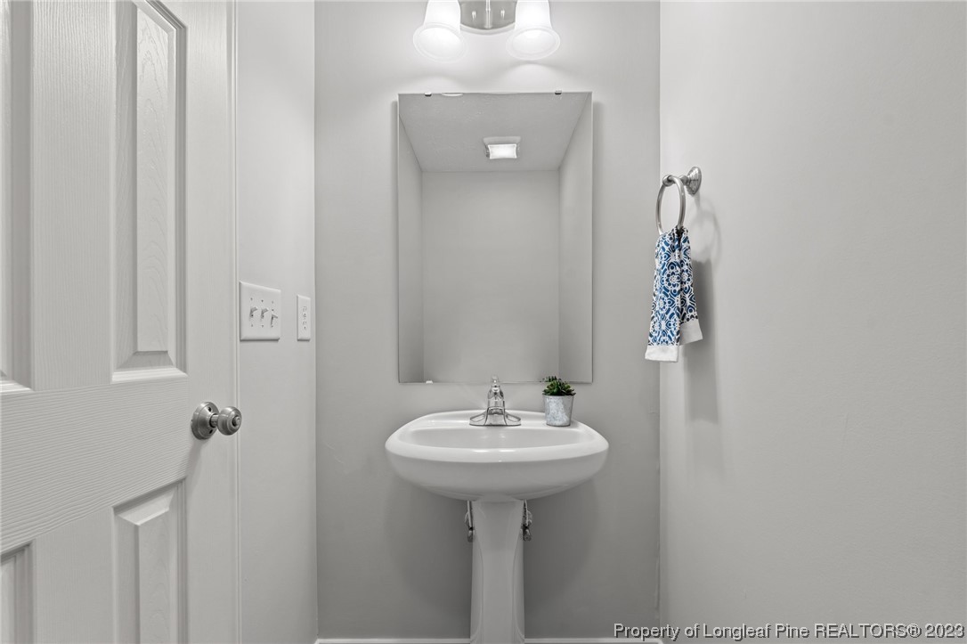 195 Culpepper Road Cameron, NC 28326 - Photo 18 of 46 a bathroom with a sink and a mirror
