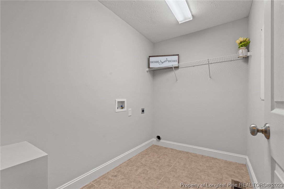 195 Culpepper Road Cameron, NC 28326 - Photo 19 of 46 a view of a room with racks on the wall