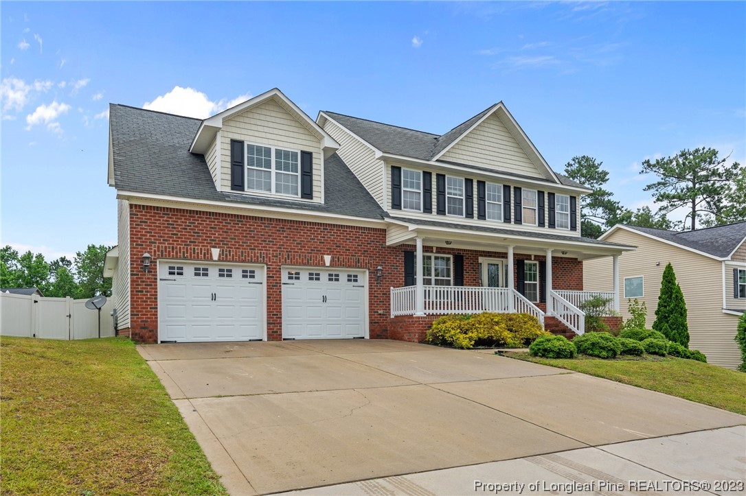 195 Culpepper Road Cameron, NC 28326 - Photo 2 of 46 a front view of a house with garden