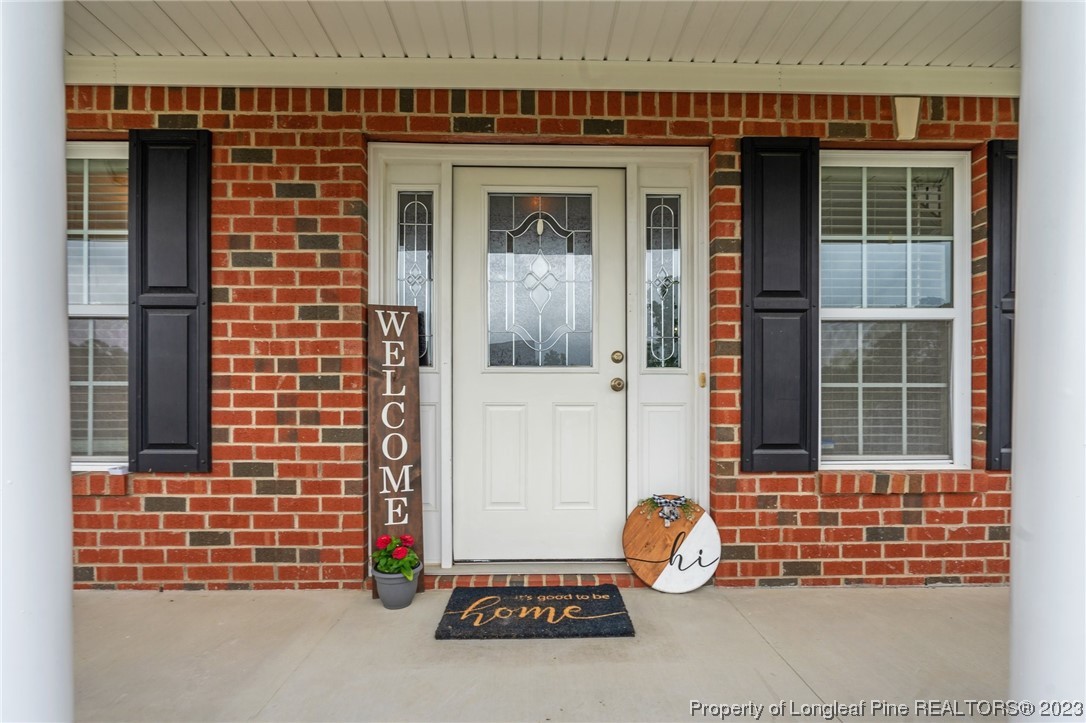 195 Culpepper Road Cameron, NC 28326 - Photo 4 of 46 a front view of a house with glass windows