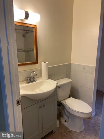 a bathroom with a toilet and a sink