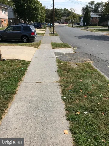 a view of street with parked cars