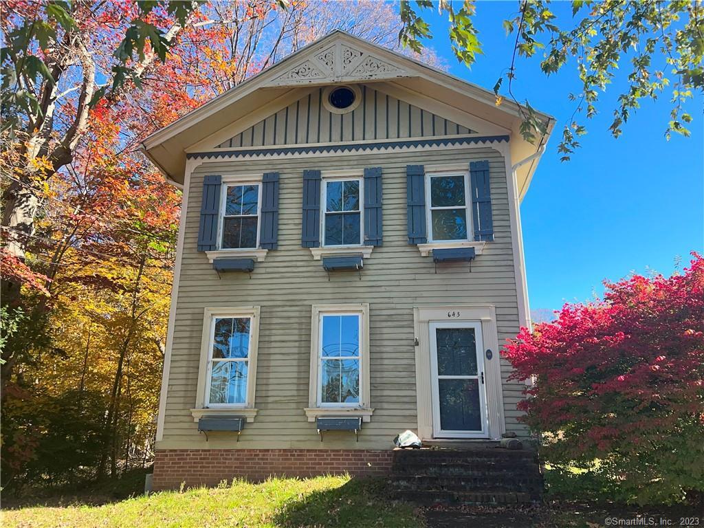 643 Orange Center Road Orange, CT 06477 - Photo 1 of 1 a front view of a house with a yard