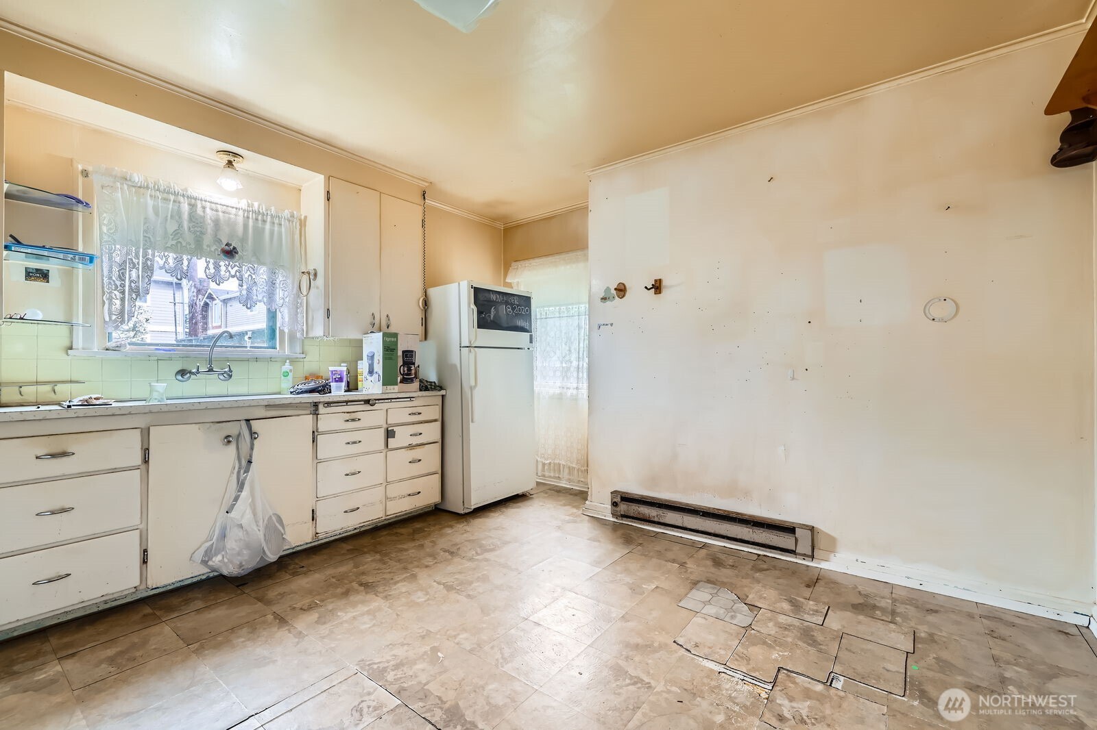 621 Daley Street Edmonds, WA 98020 - Photo 8 of 19 a kitchen with cabinets and window