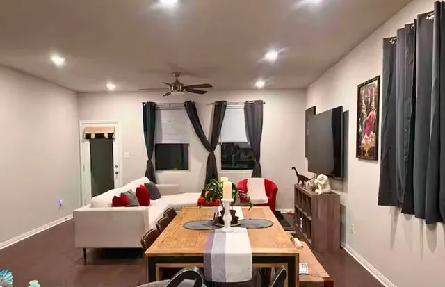 a living room with furniture and a flat screen tv