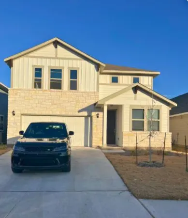 a car parked in front of a house