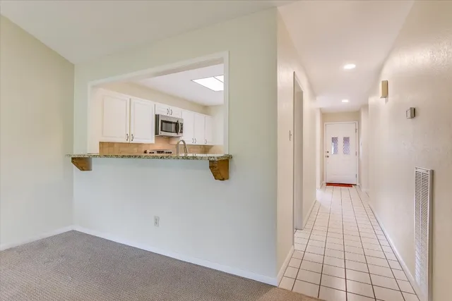 a view of a kitchen with a sink