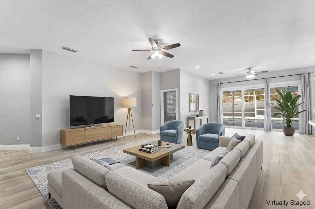 132 East Hampton Way Jupiter, FL 33458 - Photo 8 of 43 Hampton living room staged