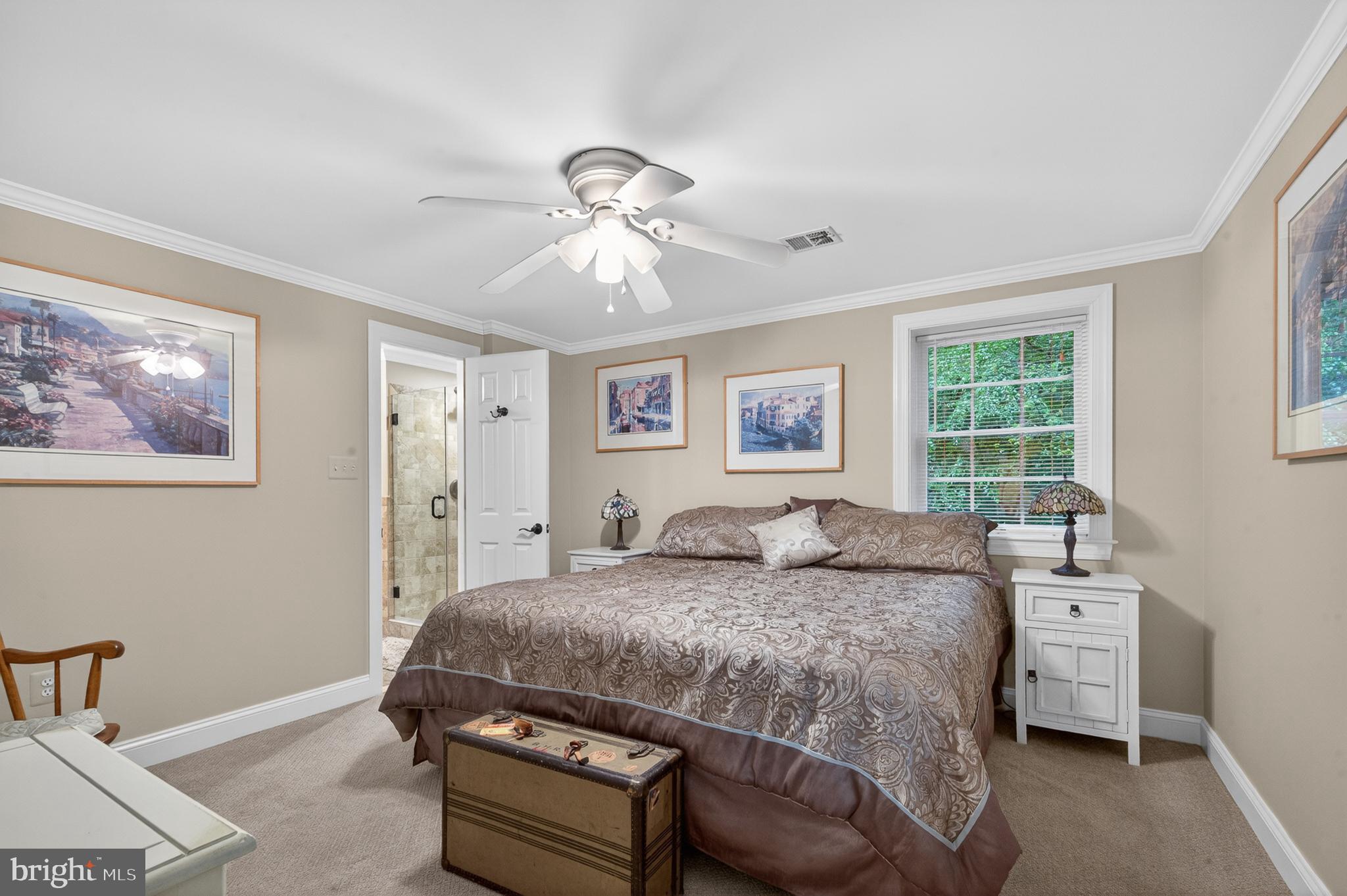 6601 Colchester Road Fairfax Station, VA 22039 - Photo 55 of 78 a bedroom with a bed and a window