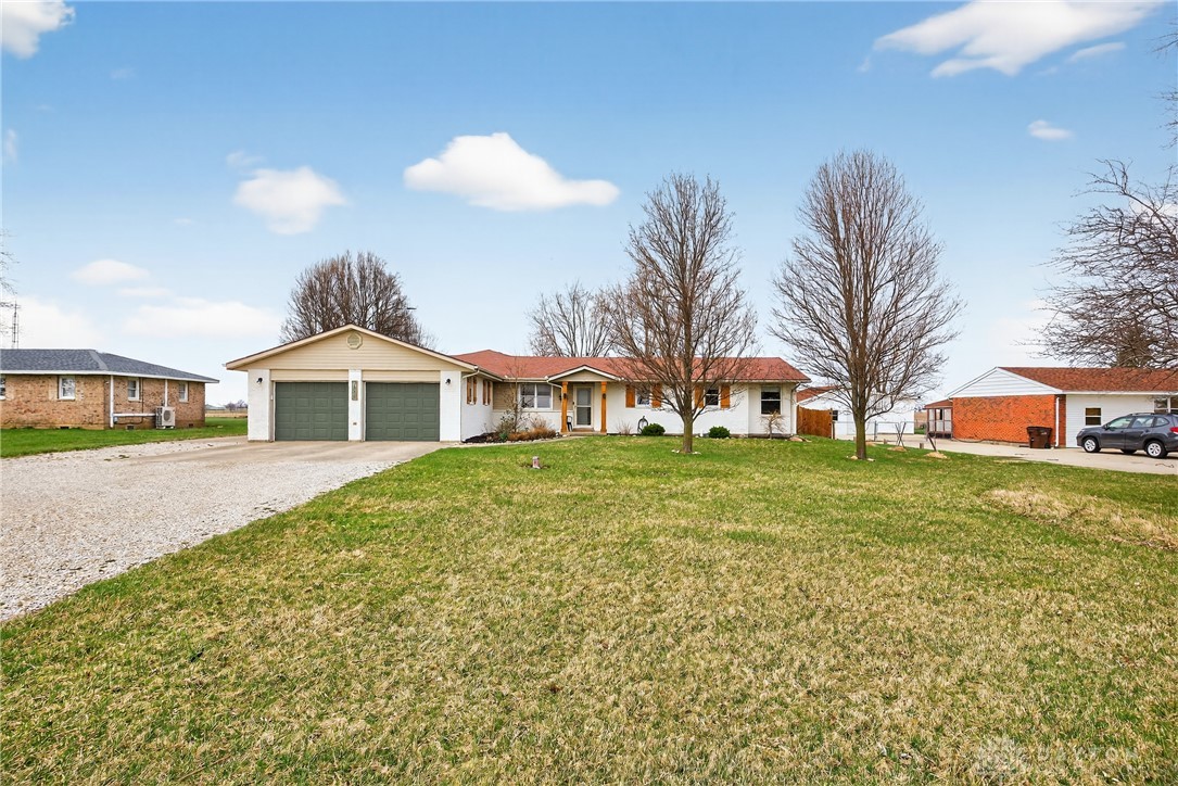 7888 Darke-Preble County Line Road Arcanum, OH 45304 - Photo 4 of 51 This charming home features an attached garage and a spacious front yard, perfect for outdoor activities.