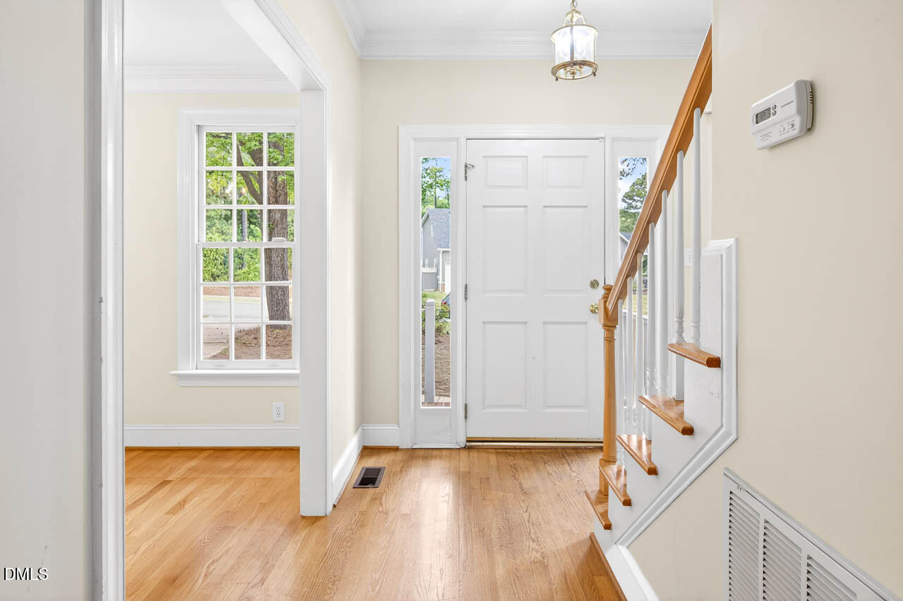 2209 Lodestar Drive Raleigh, NC 27615 - Photo 22 of 50 a view of an entryway with wooden floor