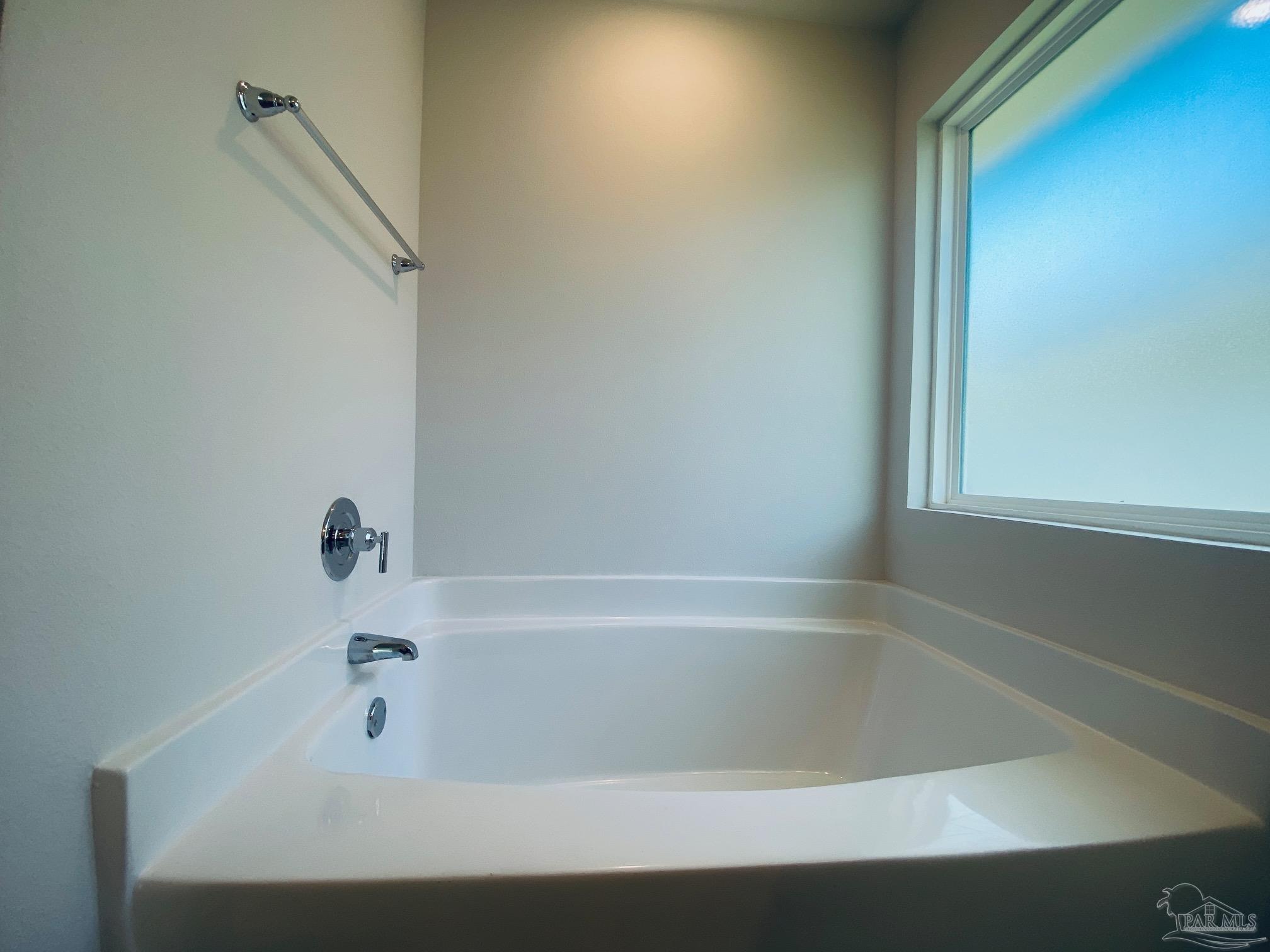 3021 Serviceberry Road Cantonment, FL 32533 - Photo 11 of 21 a bathroom with a bathtub