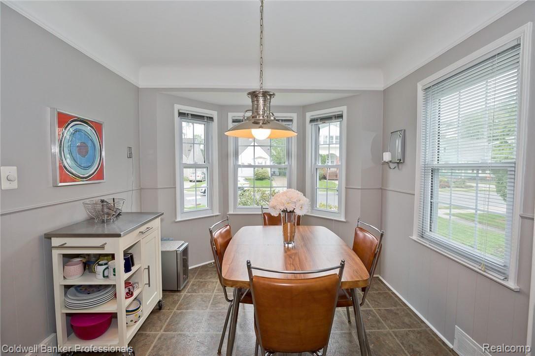 1059 Harvard Road Berkley, MI 48072 - Photo 10 of 20 Spacious dining room is just off the kitchen. Fantastic front bay window and neutral decor.