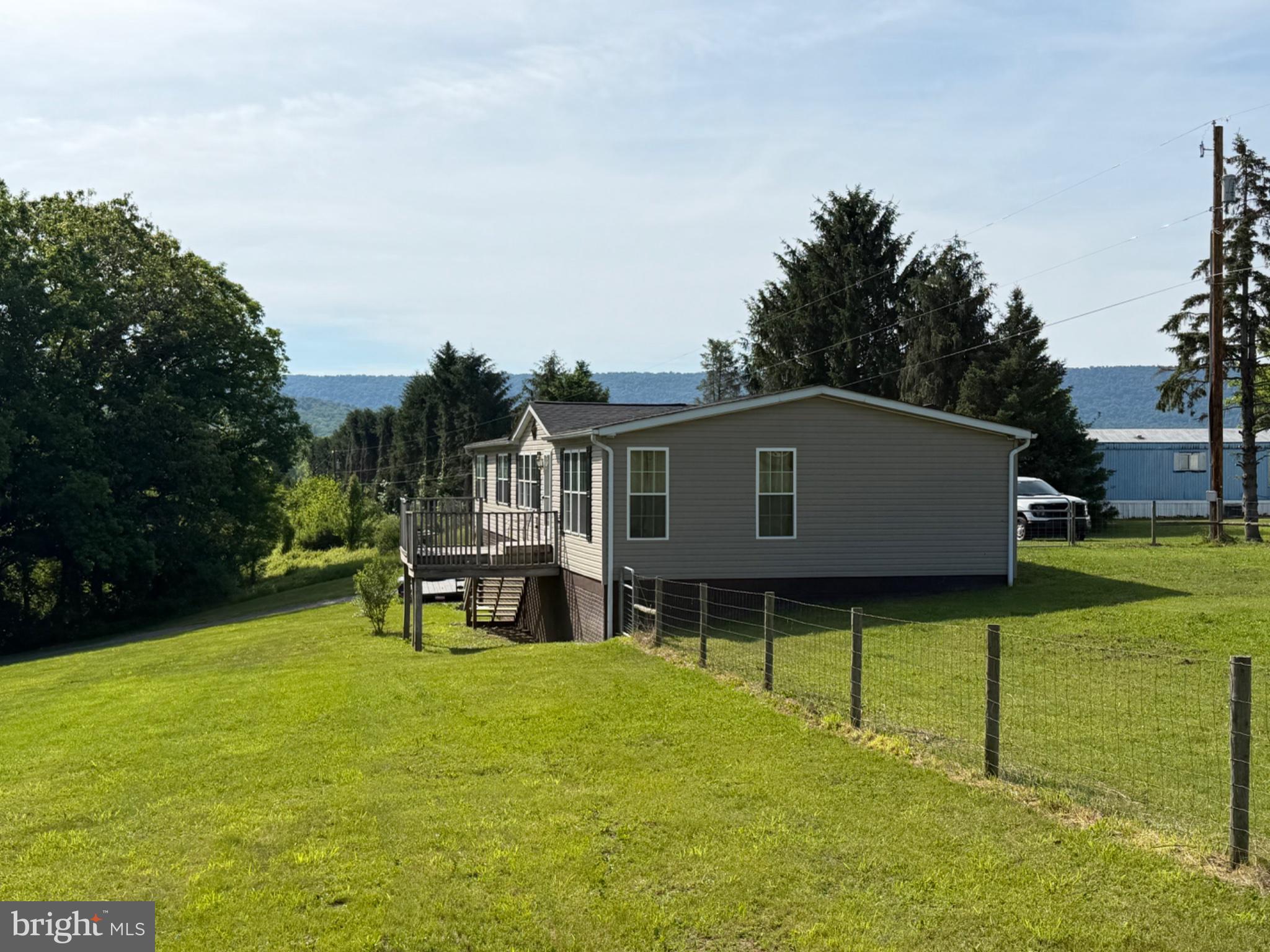 1898 Sawmill Road Hedgesville, WV 25427 - Photo 4 of 6 Charming home on lush green hillside.
